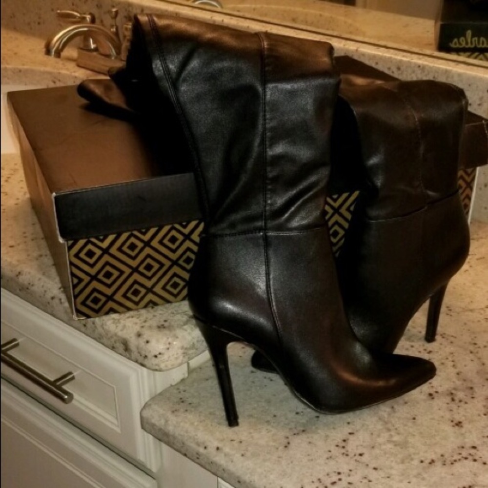 Thigh high black leather boots